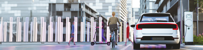 Ein Elektroauto steht in einer futuristischen Stadtlandschaft an einer Ladesäule. Daneben eine Radfahrerin. 
